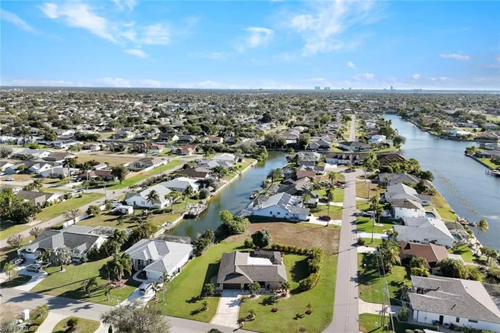 View of property location with nearby suburban area and a large body of water