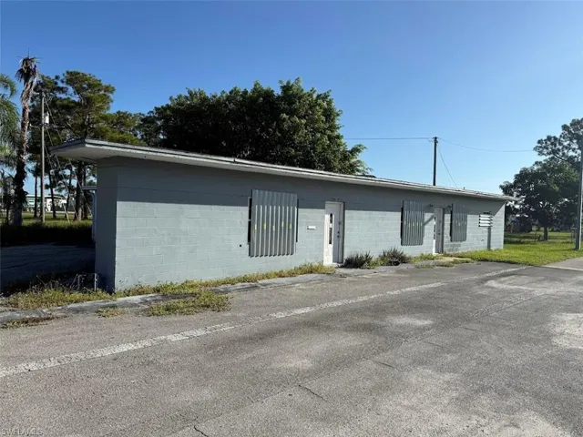 View of front facade featuring concrete block siding