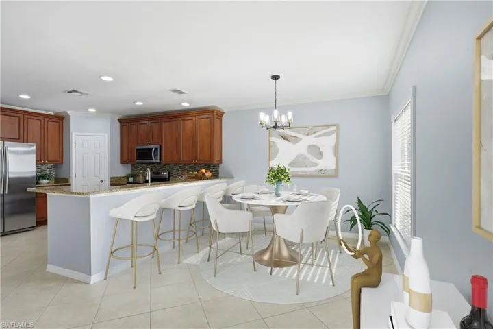 Kitchen and dining area featuring wood-finish cabinetry, stainless steel appliances, granite countertops, and tile flooring