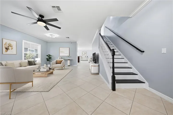 Open-concept living space featuring expansive tile flooring throughout