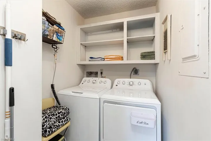 Laundry area with washing machine and clothes dryer