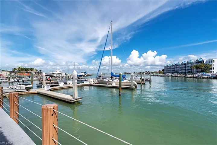 Dock area with a water view and view of marina