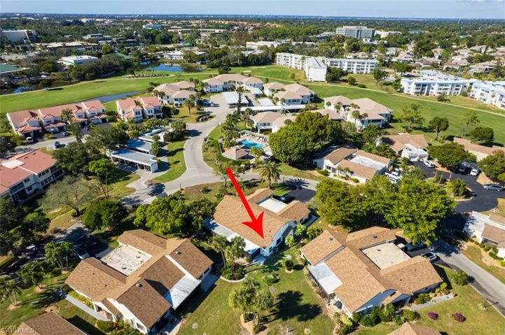 Aerial view of property and surrounding area featuring nearby suburban area