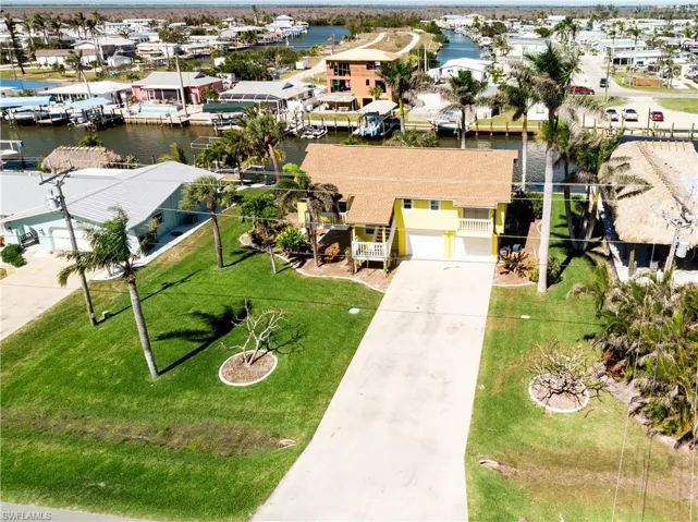 Drone / aerial view featuring a residential view and a water view
