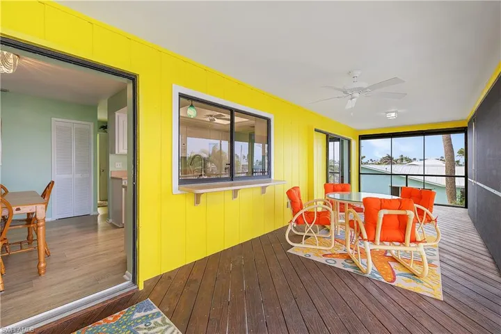 Sunroom with a ceiling fan