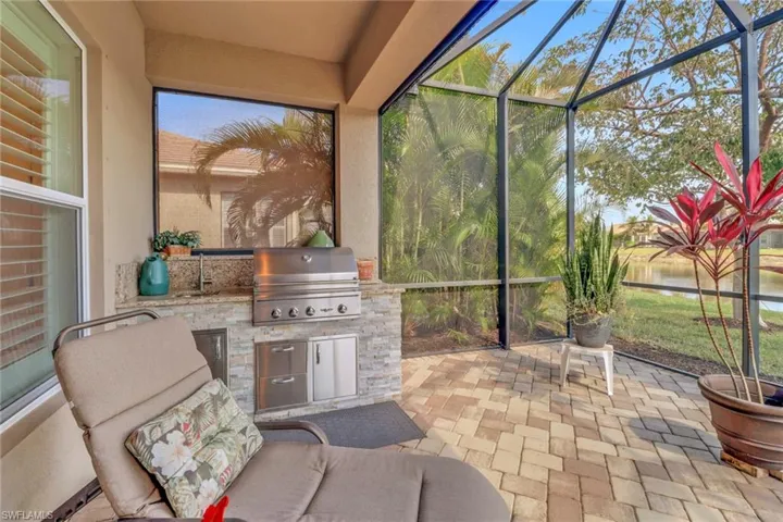 Sunroom / solarium featuring sink