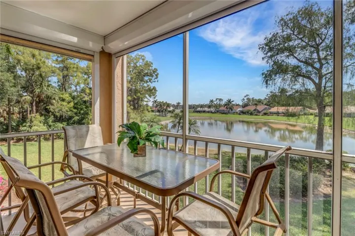 Sunroom with a water view