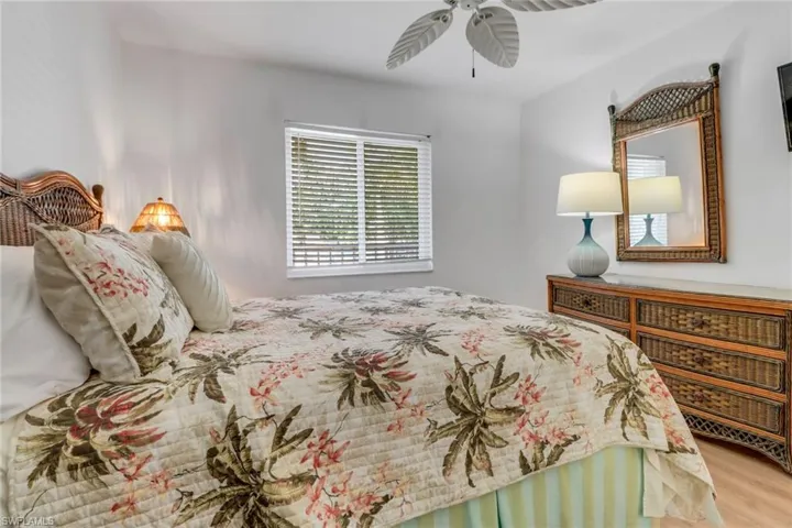 Bedroom with wood finished floors and a ceiling fan