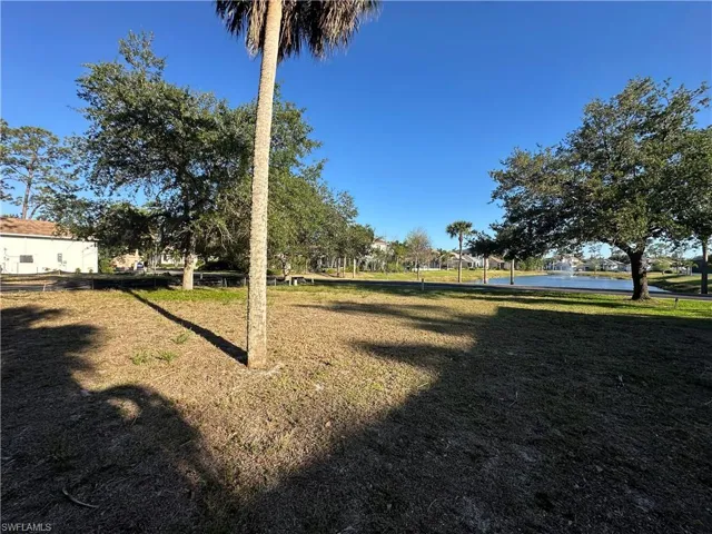 View of yard with a water view