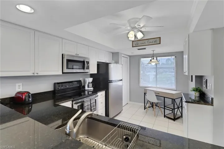 Kitchen with coffered ceiling & fan.  Stay cool.