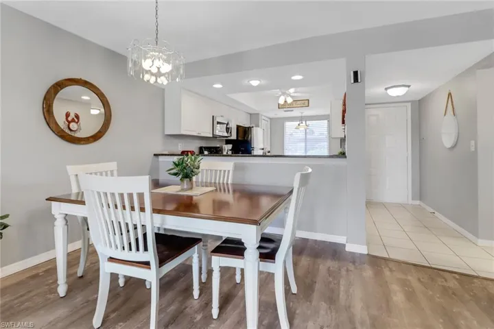 Dining Table easily can seat 6, flows into living room with lake view