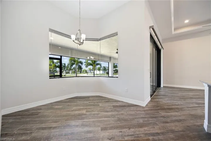 Breakfast Area with Large Mitered Glass Window Overlooking the Garden