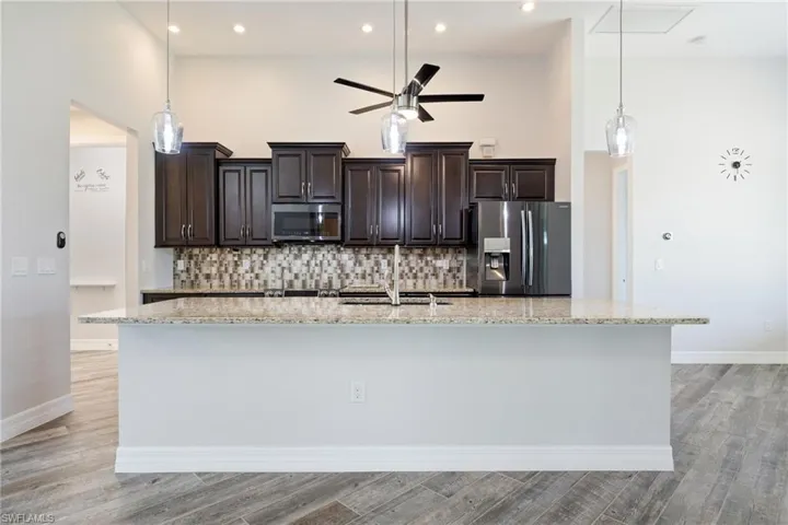 Fantastic Kitchen with Attractive Wood Cabinetry & Large Island