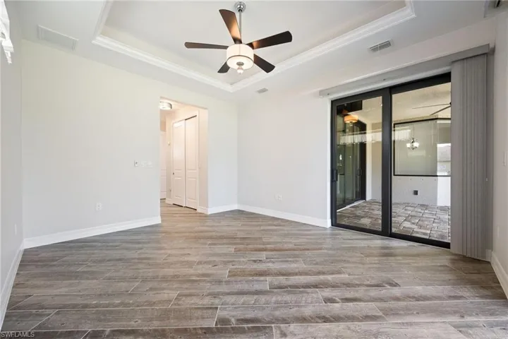 Primary Bedroom with Beautiful Wood-Look Tile Flooring