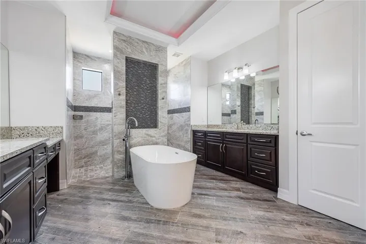 Primary Bathroom with Separate His & Her Sinks & a Soaker Tub