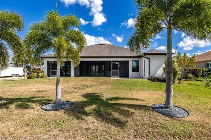 View of Back of Home with Yard