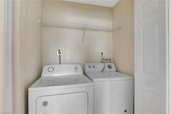Laundry area featuring separate washer and dryer