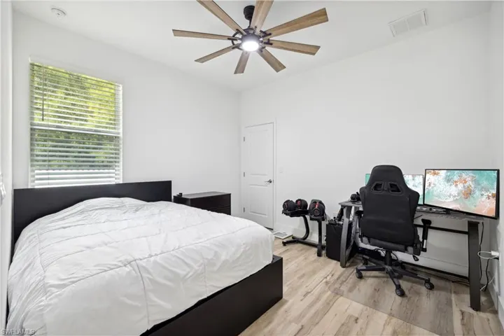 Bedroom with light wood-type flooring and ceiling fan