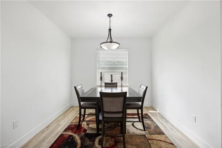 Dining space with wood-type flooring