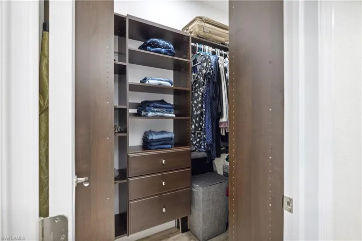 Spacious closet featuring light hardwood / wood-style floors