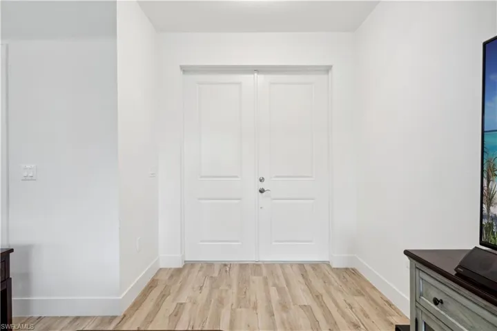 Entrance foyer featuring light hardwood / wood-style flooring