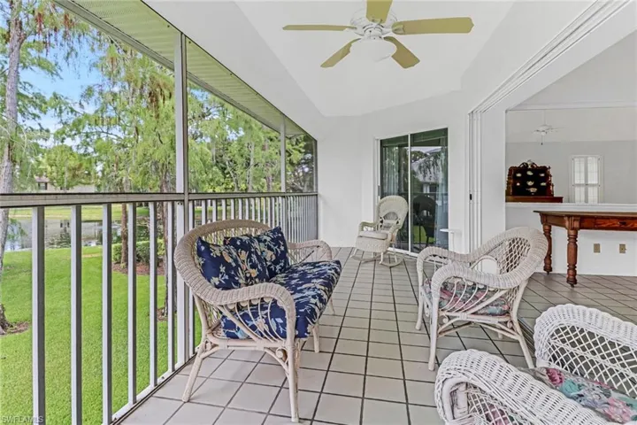 Sunroom with plenty of natural light, ceiling fan, and lofted ceiling