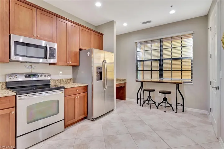 New led can lights, spacious eat-in kitchen with desk by the window and walk-in pantry