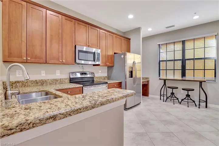 Bright and airy kitchen with pull out shelves in the lower cabinets
