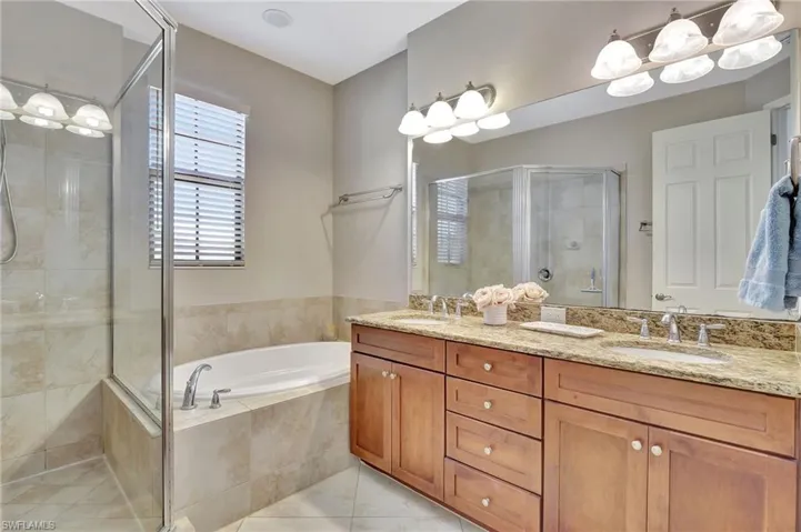 Ensuite primary bath with dual sinks, soaking tub and stall shower