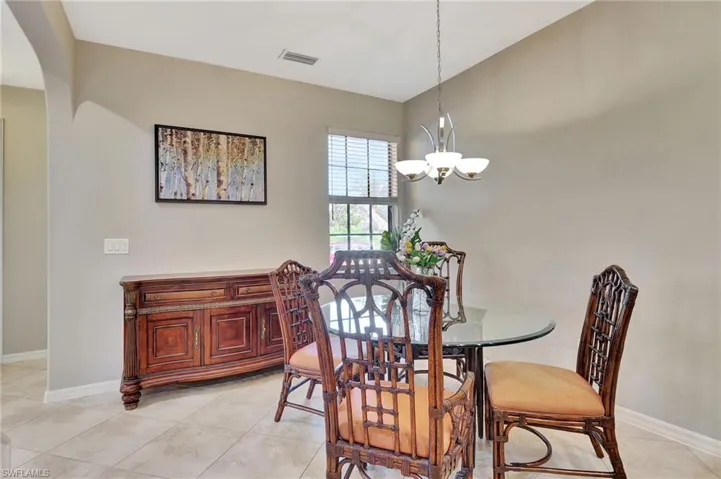 Bright dining room with window overlooking park