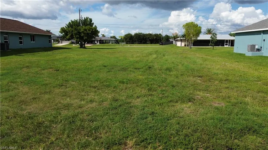 Expansive grassy lot providing ample space for development