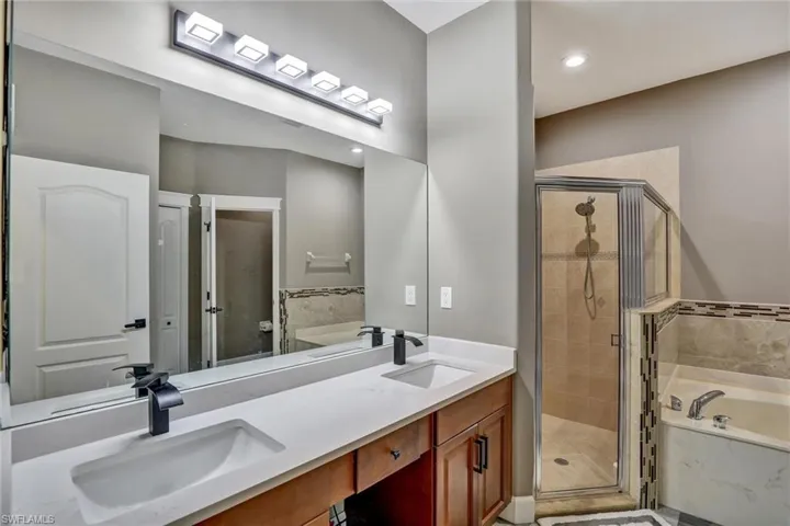 Dual vanity with integrated sinks and matte black fixtures
