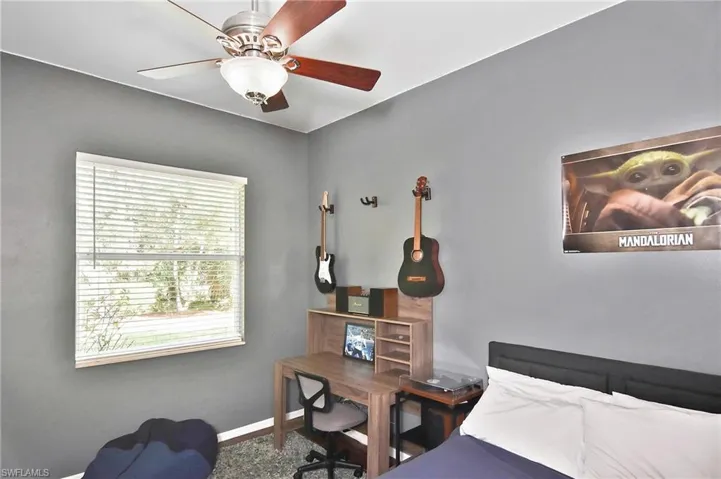Bedroom with baseboards and ceiling fan