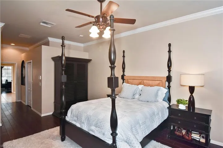 Bedroom with ornamental molding, hardwood / wood-style floors, a ceiling fan, and recessed lighting