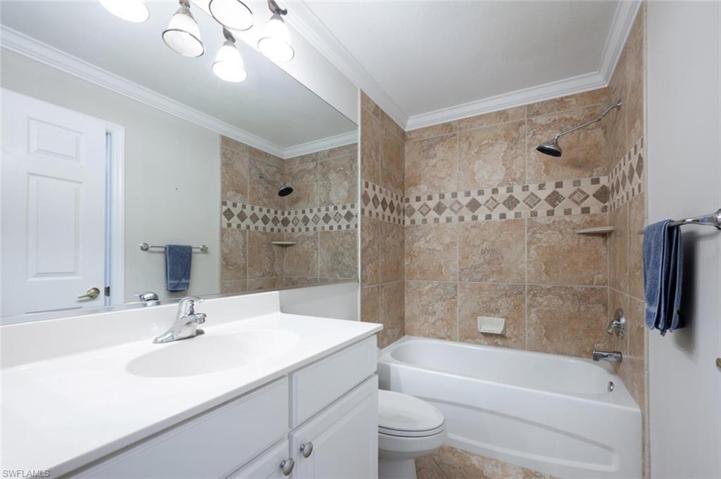 First Floor Guest Bathroom with Combination Tub and Shower