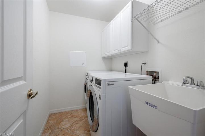 Laundry Room with Cabinet Storage and Tub Sink