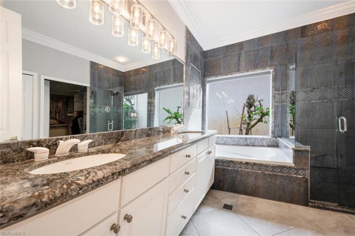 Dual Sinks , Custom Mirrors, Separate Tub and Tile Shower