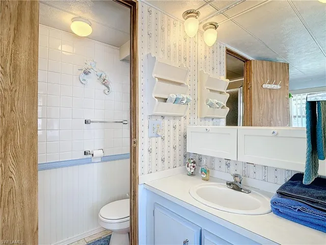 Bathroom with vanity and toilet