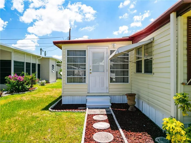 Property entrance featuring a yard