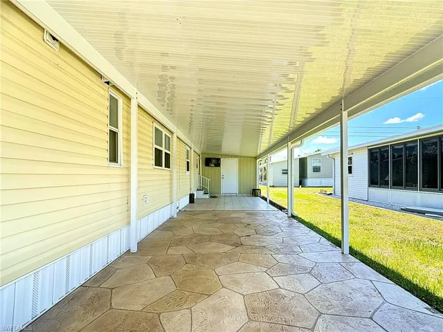 View of patio / terrace featuring a carport
