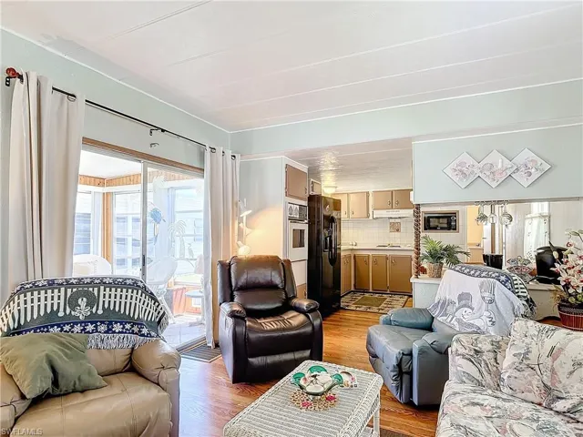 Living room with wood-type flooring