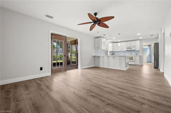 Family Room looking toward the Screened Lanai and Remodeled Kitchen