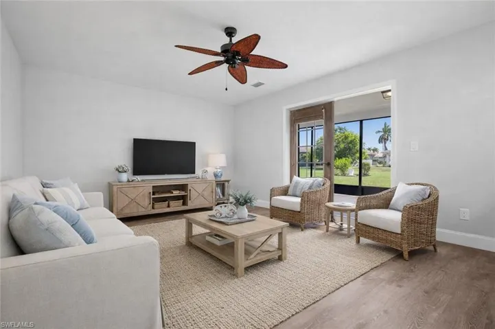 **VIRTUALLY STAGED** Family Room just steps from the screened lanai