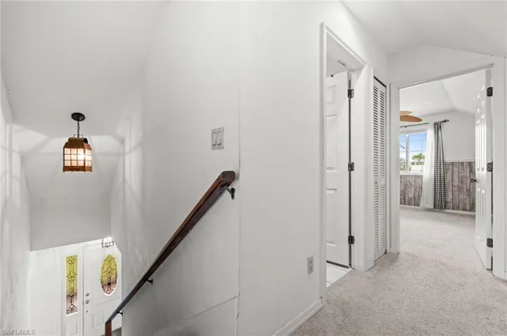Hallway at the top of the stairs, overlooking bedroom 3 and the 2nd  bath