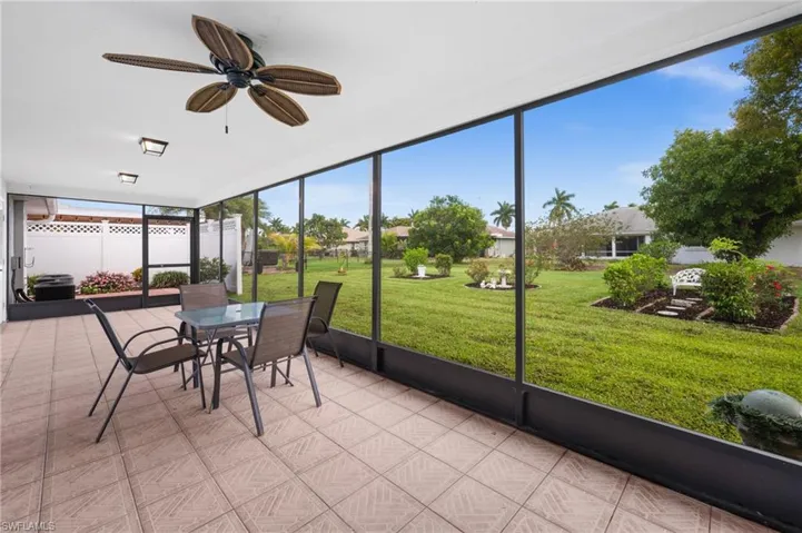 Large covered lanai, screened in, overlooking the yard