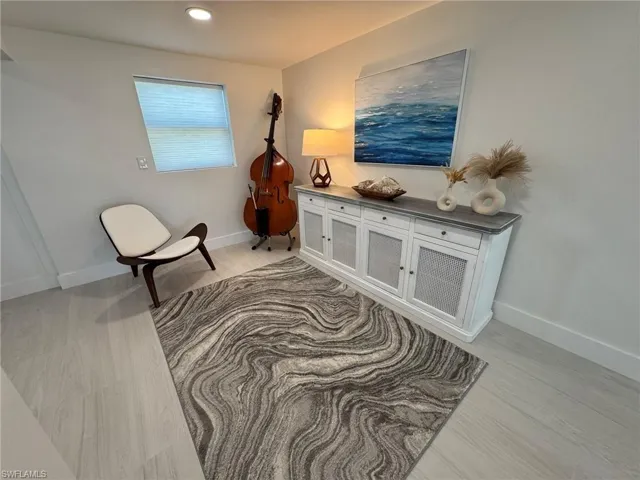 DOWNSTAIRS Sitting room featuring light hardwood / wood-style floors