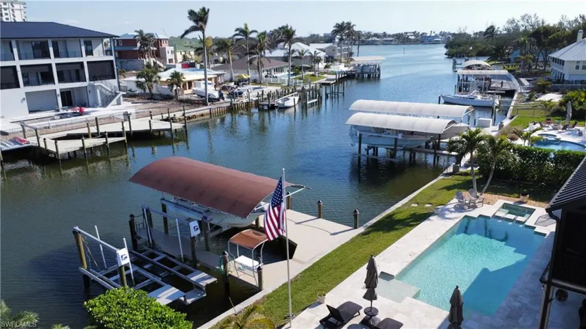 Dock area featuring a patio area and a water view