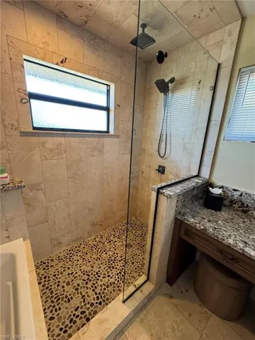 MASTER Bathroom featuring tiled shower