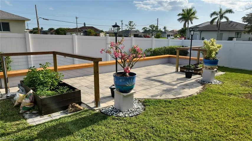 New Yard paver terrace with concrete seating and wood on top