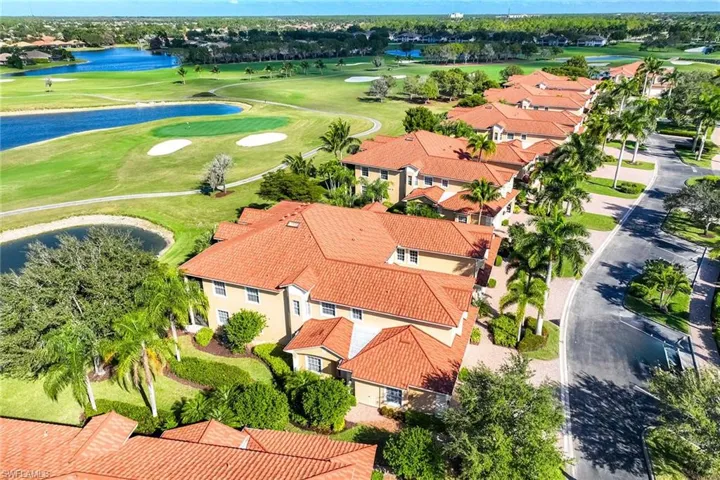 Aerial view of residential area featuring a local golf course